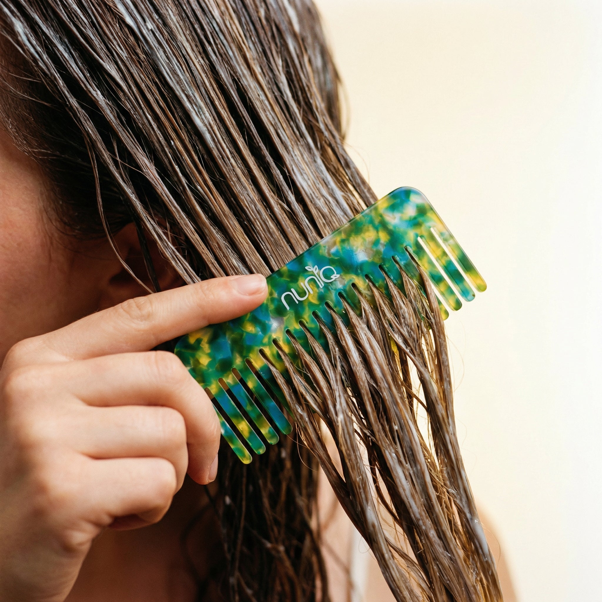 woman combing her hair