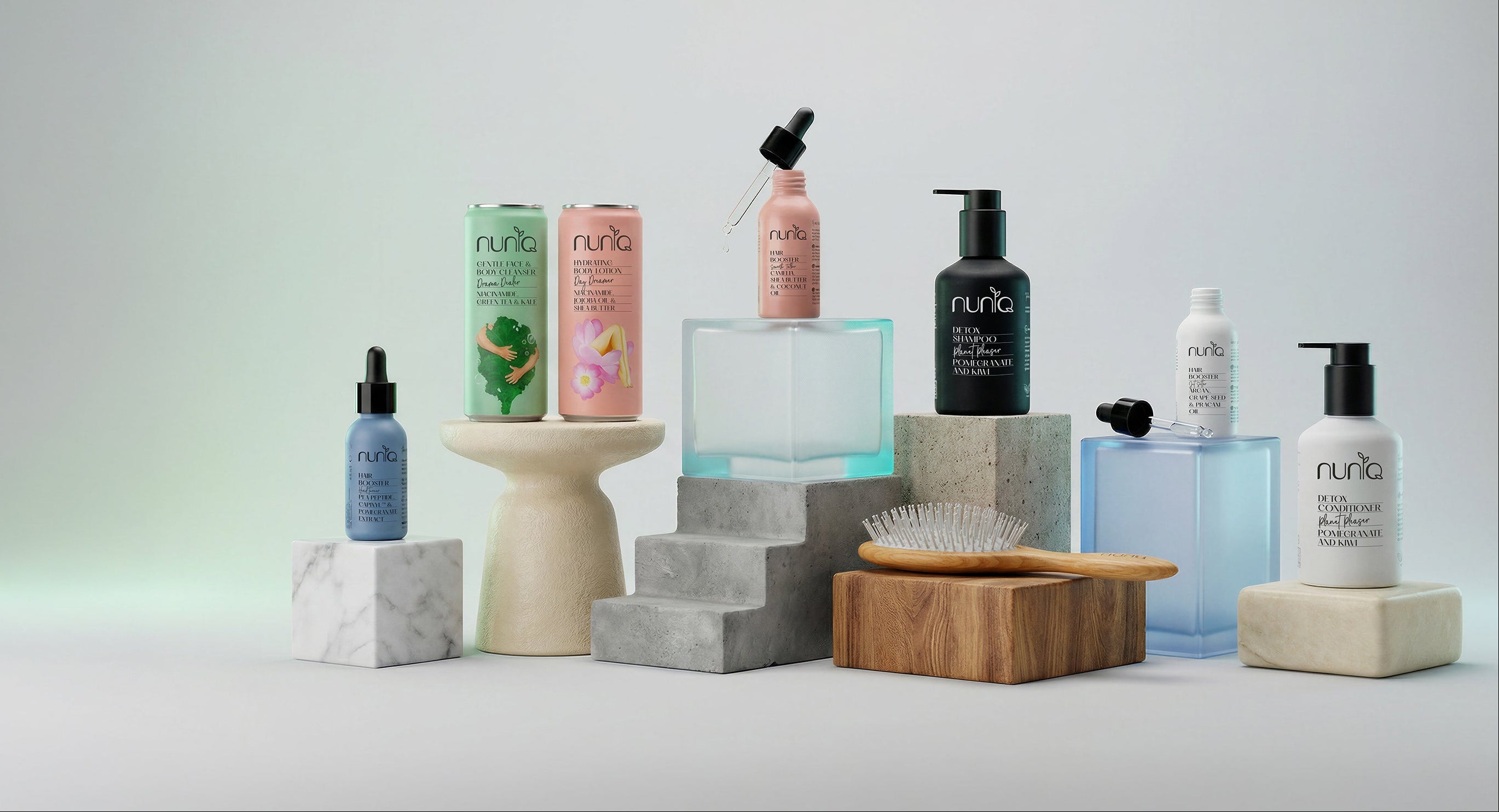 Collection of Nuniq skincare and haircare products on a neutral background