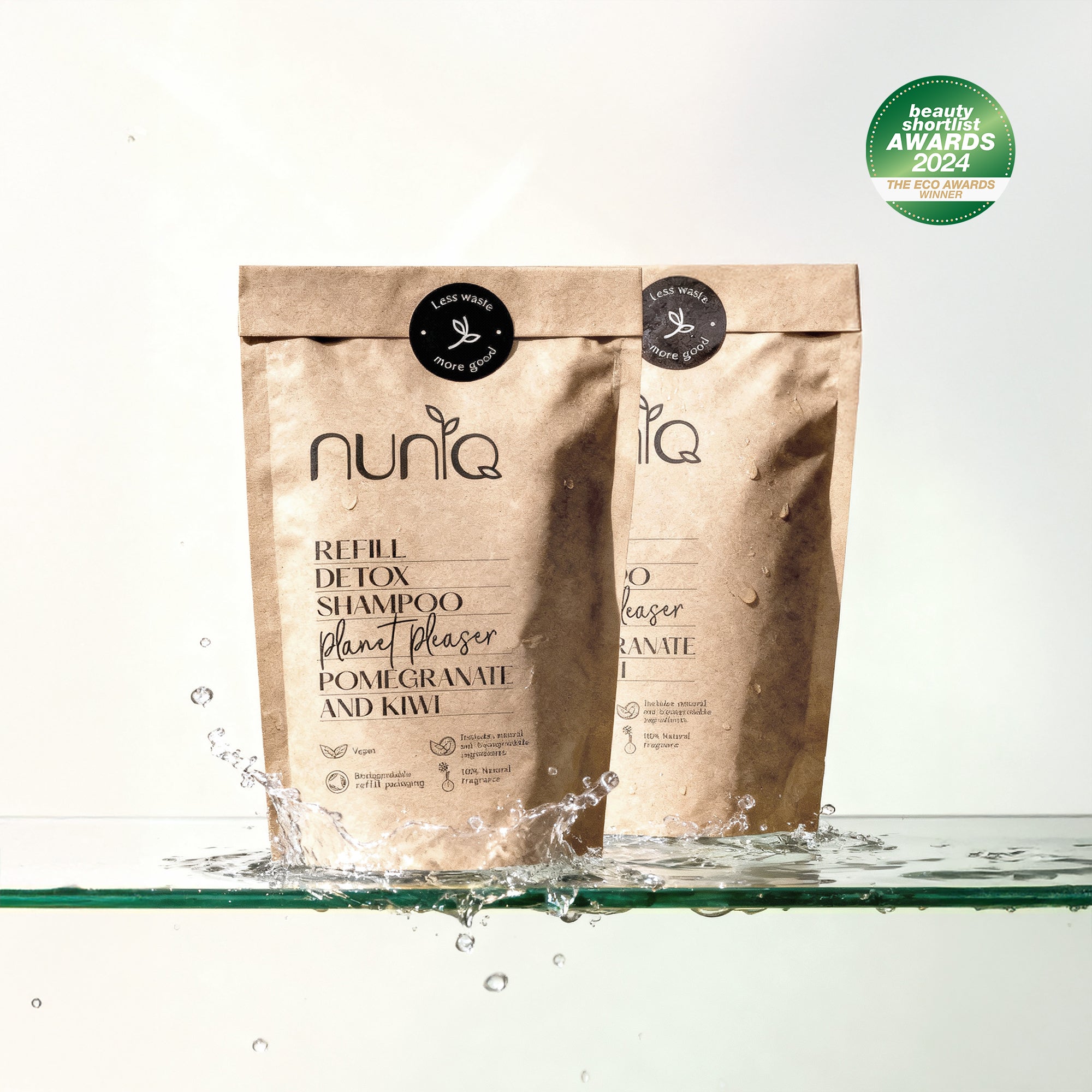 Nuniq refill detox shampoo packaging with water splash on a white background