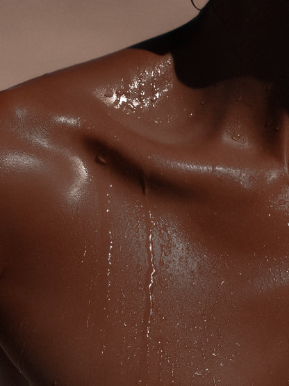 close up of a shoulder in the shower