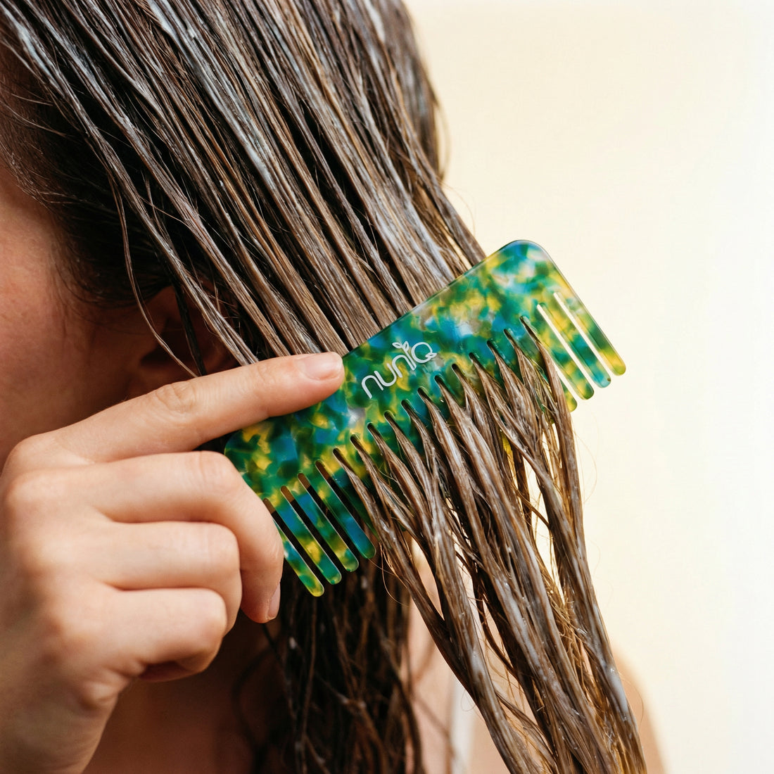 woman combing her hair