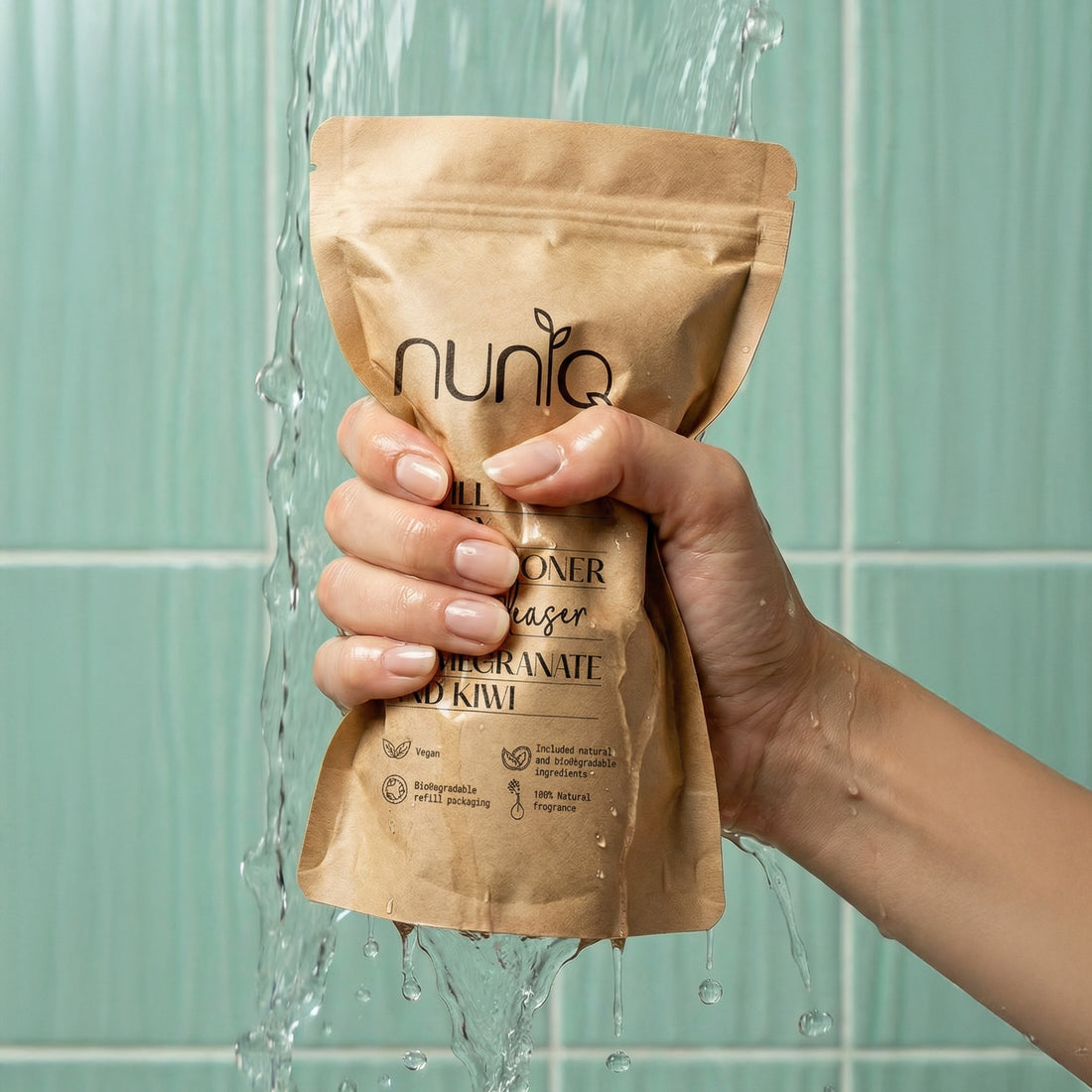 Hand holding a brown package labeled &