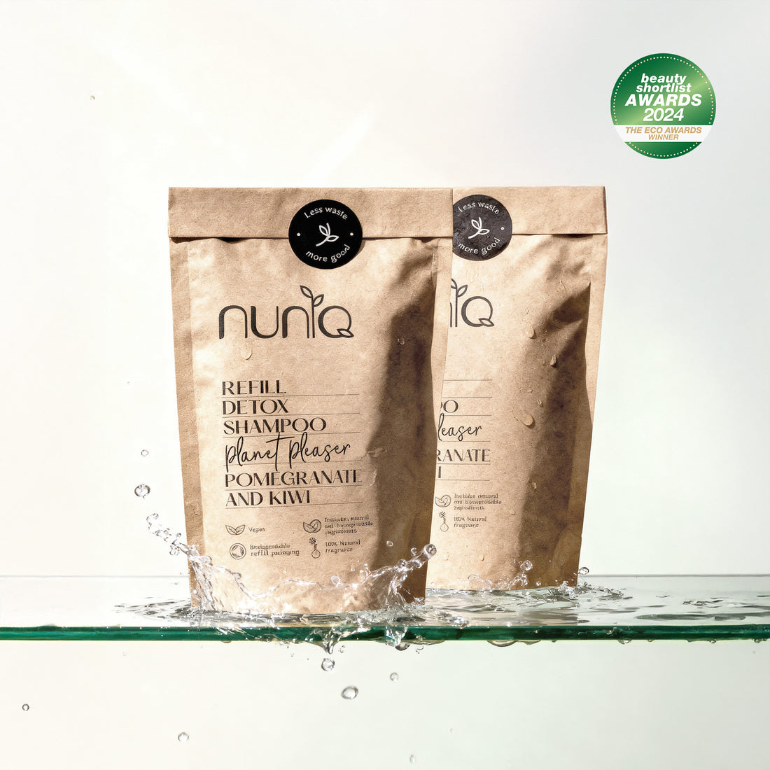 Nuniq refill detox shampoo packaging with water splash on a white background
